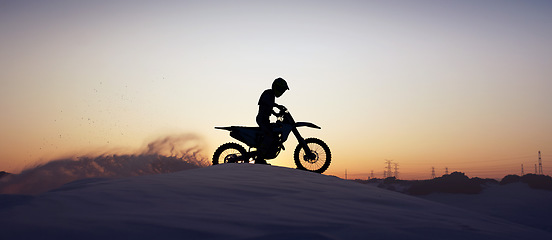 Image showing Motorcycle, sport and silhouette of man on bike at night, sky and background in nature. Fitness sports, exercise biking or motorbike person driving on dirt sand, hill mountain or desert for health