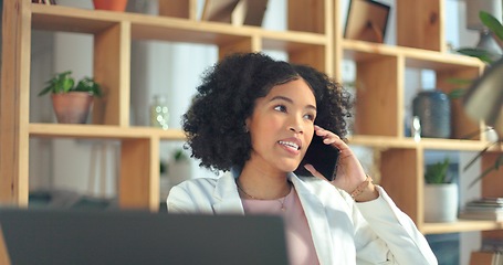 Image showing Phone call, communication and business woman with a laptop for networking, planning and creative work in an office. Advertising, talking and African employee on a mobile for a strategy for a startup