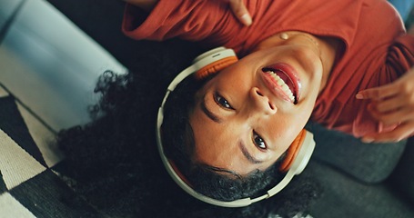 Image showing Headphones, listening and dance of black woman on a sofa excited for subscription service, technology and home connection. Happy, relax and girl portrait dancing on couch while listening to music app