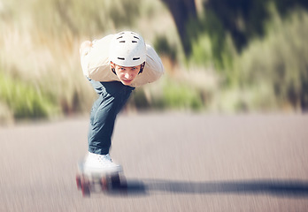 Image showing Motion blur, skateboard and mock up with a man athlete training outdoor on an asphalt street at speed. Skating, fast and mock up with a sports male on a road for fun, freedom or adrenaline outside