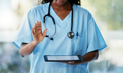 Image showing Healthcare, tablet and doctor with stethoscope in hospital checking results after a consultation. Medical, technology and African female nurse with a mobile device for research in a medicare clinic.