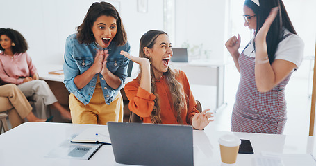 Image showing Success, fist bump or happy employees with a handshake in celebration of digital marketing sales goals at office desk. Laptop, winner or excited women celebrate winning an online business deal at job