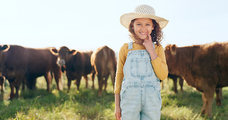 Image showing Happy child, farming and fun learning to care for animals, cows and cattle during nature travel in countryside. Portrait of girl kid smiling and happy enjoying rural beef farm life and sustainability