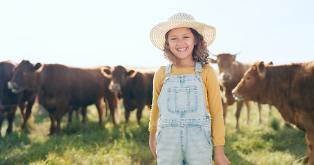 Image showing Happy child, farming and fun learning to care for animals, cows and cattle during nature travel in countryside. Portrait of girl kid smiling and happy enjoying rural beef farm life and sustainability