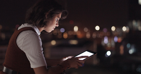 Image showing Woman, tablet and balcony at night in city for digital marketing, online networking or planning web strategy. Creative website design, designer working on tech device and relax on building rooftop