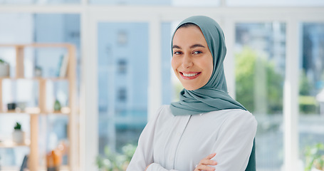 Image showing Face, mindset and vision with a business muslim woman standing arms crossed in her office at work. Portrait, confidence and empowerment with an islamic female employee working on company growthFace,