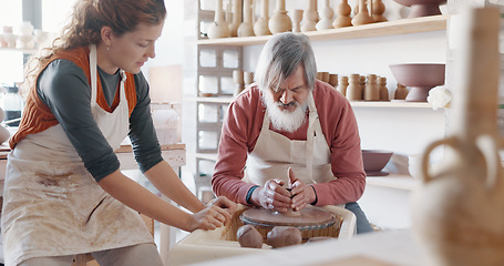 Image showing Art, learning and people in a pottery class with a young potter in a workshop for diverse people. Design, texture and creative lesson with help from young woman discussing mold and shape process