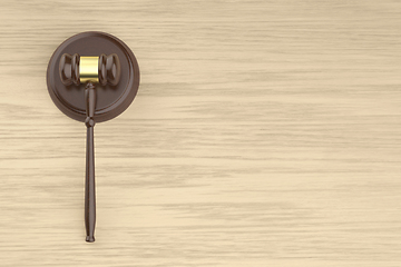 Image showing Wooden gavel on the wooden desk