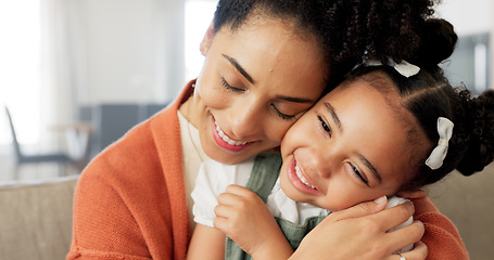 Image showing Happy, mother and child with hug, kiss and love for playful relationship bonding on living room sofa at home. Mama and kid playing together in happiness for loving care or joy relaxing on the couch