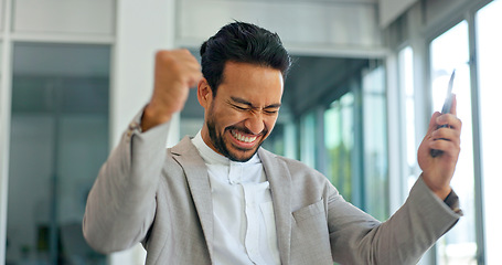 Image showing Success, phone and winner with businessman in office and celebration for deal, growth and stock market target. Wow, goals and good news with fist of employee for achievement, future and sale