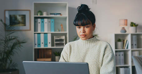 Image showing Business woman, typing on laptop and doing research while writing email or article and sitting in a modern office. Serious, creative entrepreneur using technology and online computer communication.