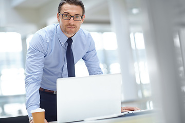 Image showing Portrait, laptop and mission with a business man at work in his office for research or innovation. Computer, mindset and vision with a male employee working on a report or planning for success