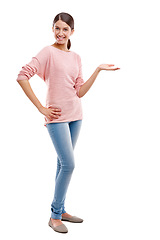 Image showing Portrait, mockup and brand with a model woman in studio isolated on a white background to promote a product. Marketing, branding and advertising with a female posing on blank product placement space