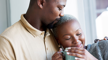 Image showing Relax, love and couple hug with coffee drink break at window to enjoy while they bond together. Kind, caring and happy boyfriend giving black woman beverage with romantic embrace in home.