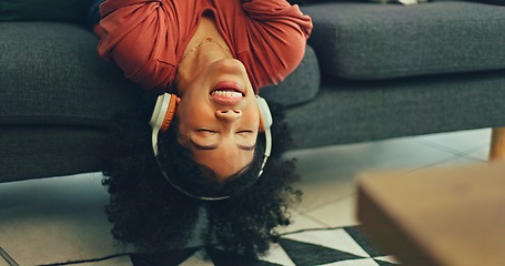 Image showing Headphones, listening and dance of black woman on a sofa excited for subscription service, technology and home connection. Happy, relax and girl portrait dancing on couch while listening to music app