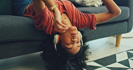 Image showing Headphones, listening and dance of black woman on a sofa excited for subscription service, technology and home connection. Happy, relax and girl portrait dancing on couch while listening to music app