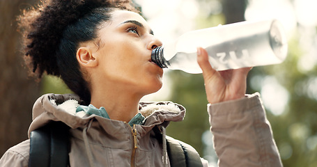 Image showing Water, hiking and woman in nature for fitness, exercise and travel in mountains of Portugal. Training, adventure and girl trekking through forest or woods for adventure, health and cardio with drink