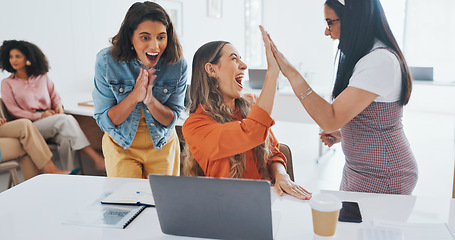 Image showing Success, fist bump or happy employees with a handshake in celebration of digital marketing sales goals at office desk. Laptop, winner or excited women celebrate winning an online business deal at job