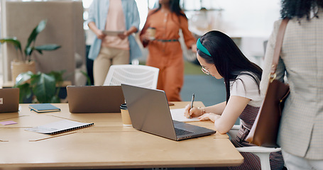 Image showing Asian woman, laptop and writing in notebook for planning strategy, schedule management or finance checklist in office. Employee, reading email communication and notes for creative startup company