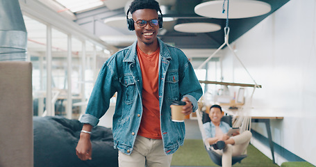 Image showing Positive, motivation and high five with a business black man walking through the office while listening to music. Carefree, success and happy with a male employee greeting a colleague group at work