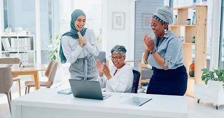 Image showing Creative business people, laptop and applause for good news, email or market sale in startup at the office. Group of employee designers celebrating win, deal or promotion on computer at the workplace