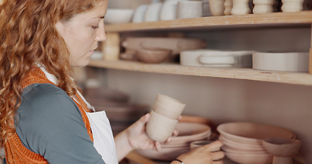 Image showing Pottery, woman artist and shelf for ceramic cups for shop, check quality for creative class or appreciate clay mold in workshop. Hobby, female entrepreneur or prepare art items to sell or for startup