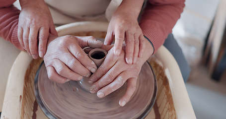 Image showing Love, pottery and hands of old couple molding in workshop studio for creative art, support and ceramics class. Trust, marriage and retirement with man and woman with clay wheel on crafting date