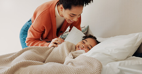 Image showing Shot of mother waking up her adorable little girl from a nap in bed