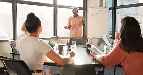Image showing Black man, leadership and presentation meeting in office boardroom for sales, marketing or advertising ideas. Whiteboard, coaching and mentor training with group of business people holding documents