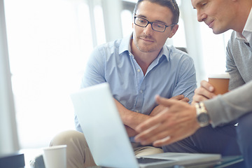 Image showing Businessman, laptop and idea strategy in discussion for deal, proposal or corporate idea at the office. Business people sharing ideas, market planning or advertising in conversation at the workplace