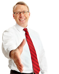Image showing Portrait, business man and handshake in studio isolated on a white background. Face, greeting and male entrepreneur shaking hands for deal, agreement or contract, onboarding or welcome introduction.