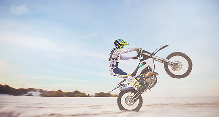 Image showing Motorbike, motorcycle athlete and desert drive with mockup cycling in nature for sport adventure. Jump, freedom and sports driving training of a man with speed on sand trail for fitness and exercise