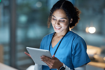 Image showing Nurse, medical tablet and black woman in hospital working late on telehealth, research or online consultation. Tech, healthcare or female physician with technology for wellness app in clinic at night