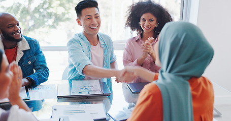 Image showing Handshake, success or happy employees meeting kpi goals, bonus achievement or sales target in office. Muslim, black woman or black man shaking hands with Japanese worker clapping for a business deal