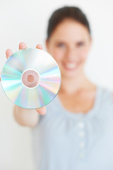 Image showing Vintage, music and hand of woman with cd in studio showing nostalgic, fun and old fashioned entertainment with mockup. Hands, dvd and girl presenting shiny disc, copy space and isolated mock up
