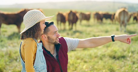 Image showing Father and daughter bonding on a cattle farm, talking and having fun while looking at animals in nature. Love, family and girl learning about livestock with caring parent, enjoying conversation