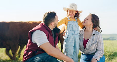 Image showing Family, farm and agriculture with a girl, mother and father on a field or meadow of grass with cattle. Sustainability, love and children with a man, woman and daughter on a farmer ranch together