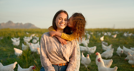 Image showing Hug, child and mother on a farm with chicken on mothers day, travel or holiday in Argentina together. Happy, portrait and kiss from girl with her mama on a field with animals during vacation