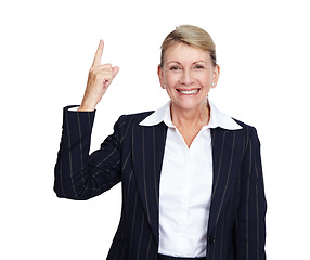 Image showing Senior businesswoman, smile portrait and pointing finger up in white background for suggestions, product placement and mockup. Elderly person, happy face and manager hand gesture isolated in studio