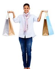 Image showing Happy, shopping and woman bags, smile and fashion sale isolated on white background. Winner discount sales and retail therapy, body portrait of girl from India smiling, holding shopping bag in studio