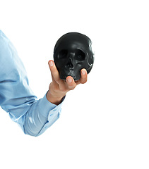 Image showing Death, danger and emoji with a skull in the hand of a man in studio isolated on a white background. Theater, mockup and anatomy with an actor on blank space for art, performance or philosophy