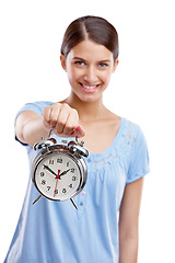 Image showing Portrait, clock and time with a model woman in studio isolated on a white background showing an alarm. Hand, vintage reminder with a female holding an alarm clock or timer on a blank space