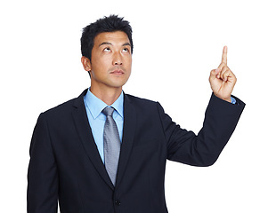 Image showing Studio, pointing and Asian business man with gesture for professional mockup space, advertising or marketing. Promotion mock up, corporate branding and Japanese model isolated on white background