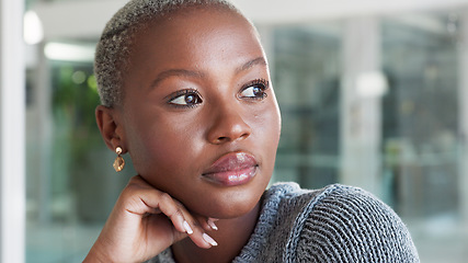 Image showing Professional black woman thinking while sitting in her office with ideas and planning marketing project. Serious, thoughtful and pensive african business woman working on advertising strategy or plan