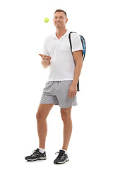 Image showing Portrait, tennis sports and man in studio isolated on a white background for exercise. Training, athlete and mature male with ball and racket ready to start workout for health, fitness and wellness.