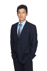 Image showing Asian businessman, hands and pocket standing in confidence against a white studio background. Portrait of a isolated confident young business man with his hands in his pockets on white background