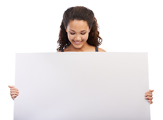 Image showing Black woman, smile and blank branding poster or billboard in studio for sales marketing, advertising and company news mockup. African girl, happy model and design signage space in white background