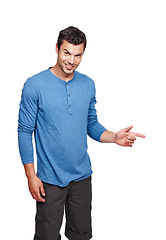 Image showing Handsome, young and portrait of a man in a studio pointing for mockup space for advertising or marketing. Happy, smile and male model from Canada with a casual outfit isolated by a white background.