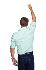 Image showing Man, first and back standing in victory for winning, discount or sale against a white studio background. Isolated male with arm in the air for achievement, goal or accomplishment for success