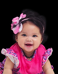 Image showing Portrait, baby and girl with a newborn infant in studio on a black background in floral clothes. Kids, flower and development with a female child on dark space for cute or adorable product placement